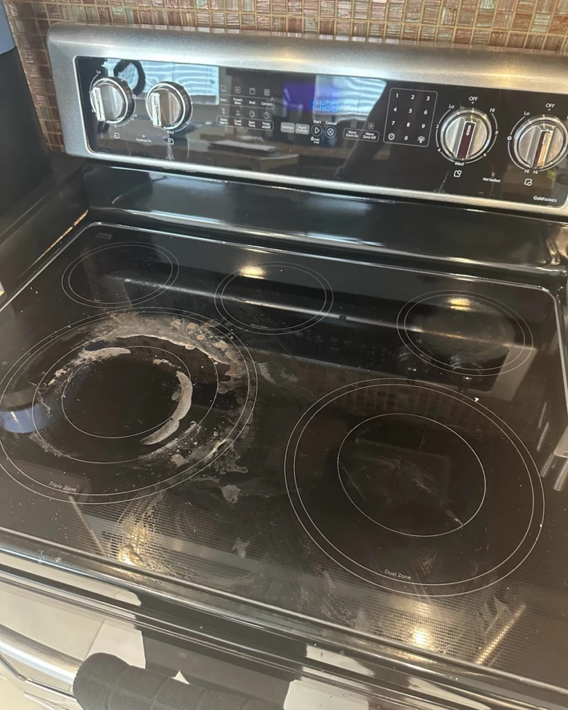 Before: glass cooktop before cleaning