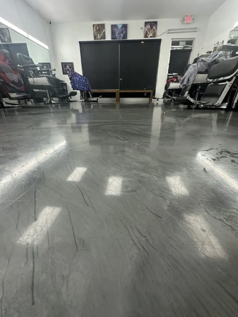 Glossy epoxy floor at a Boca Raton barbershop cleaned by Casabela